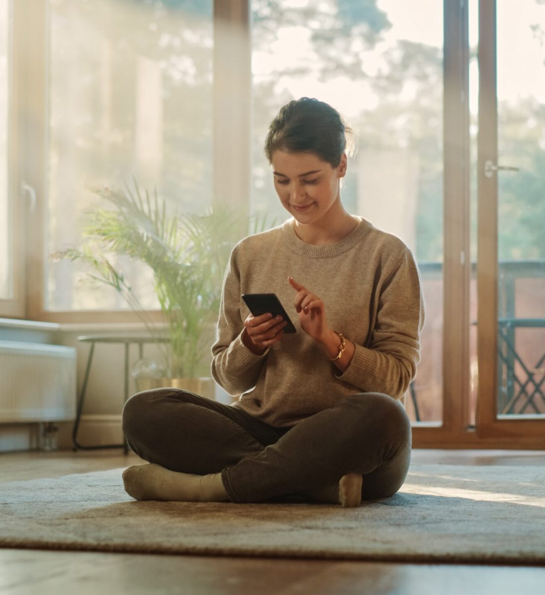 Smiling,Young,Woman,Using,Smartphone,At,Home,,Does,Remote,Work.